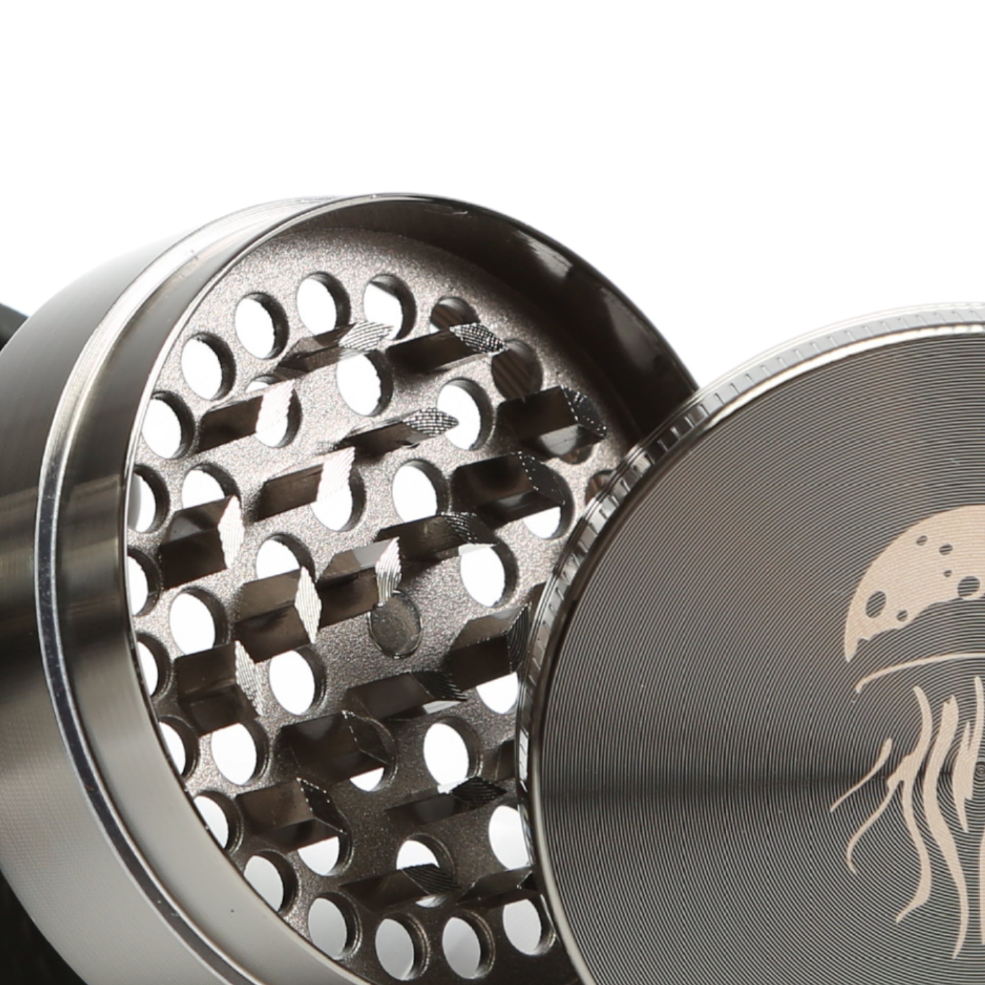 Metallic grinder with intricate design on a white background