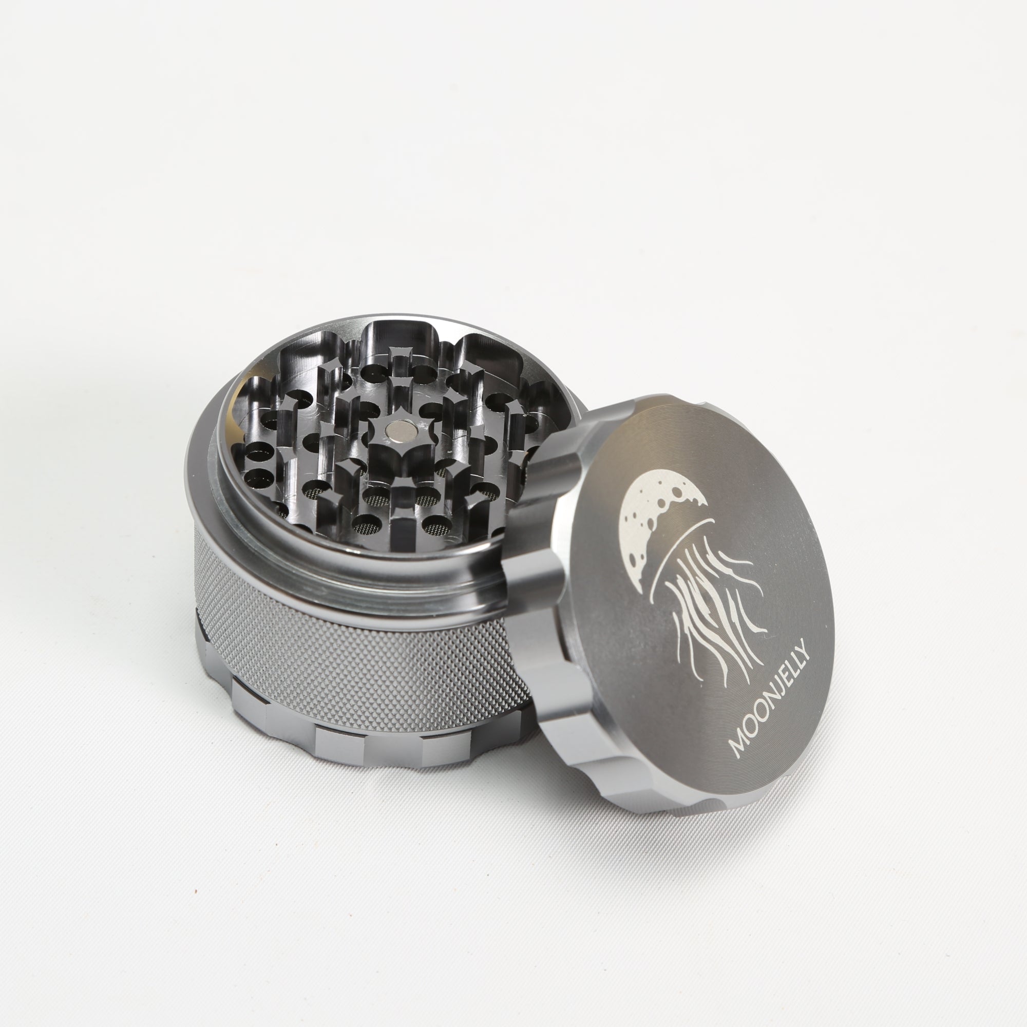 Silver herb grinder with &