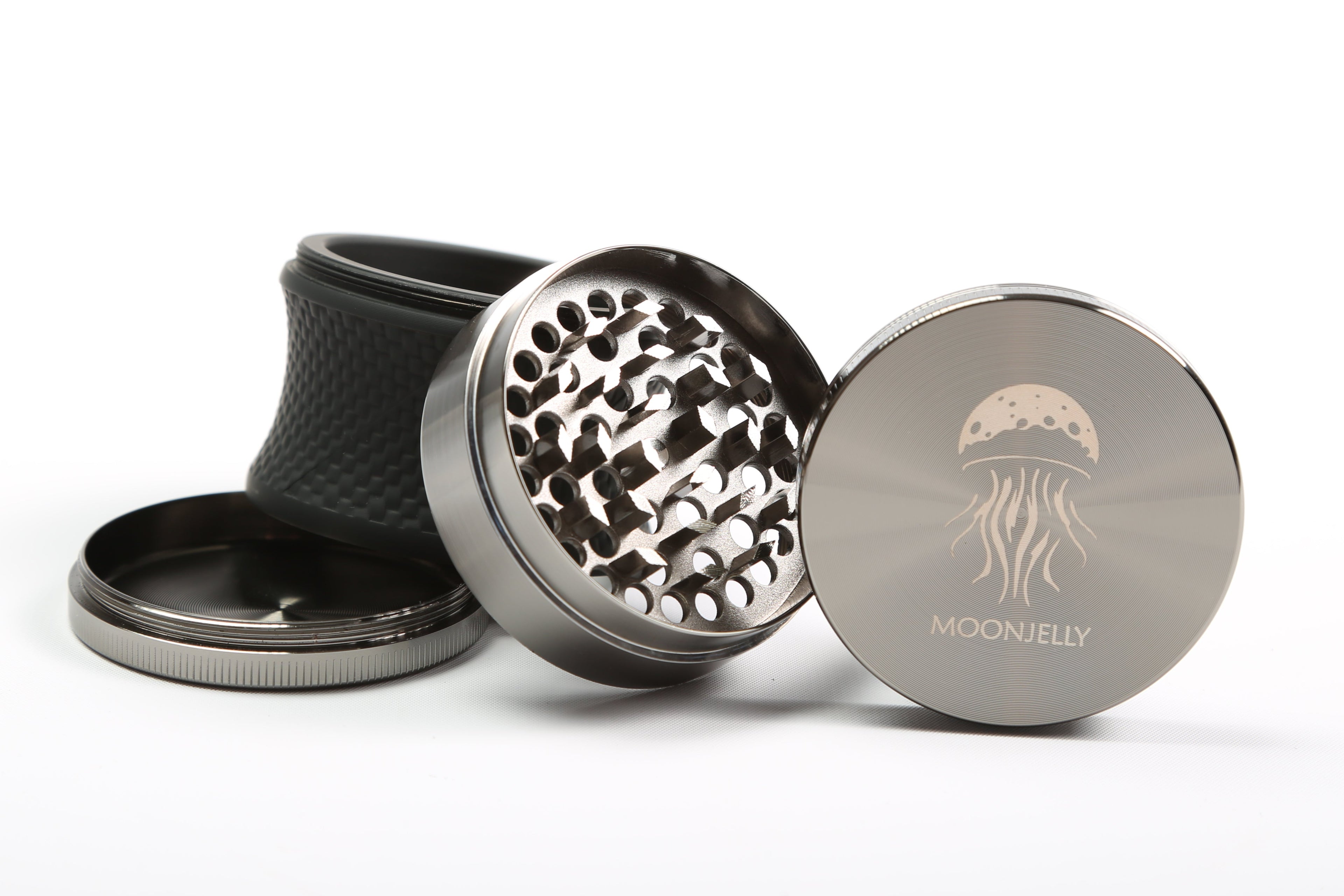 Metal grinder with 'moonjelly' branding on a white background