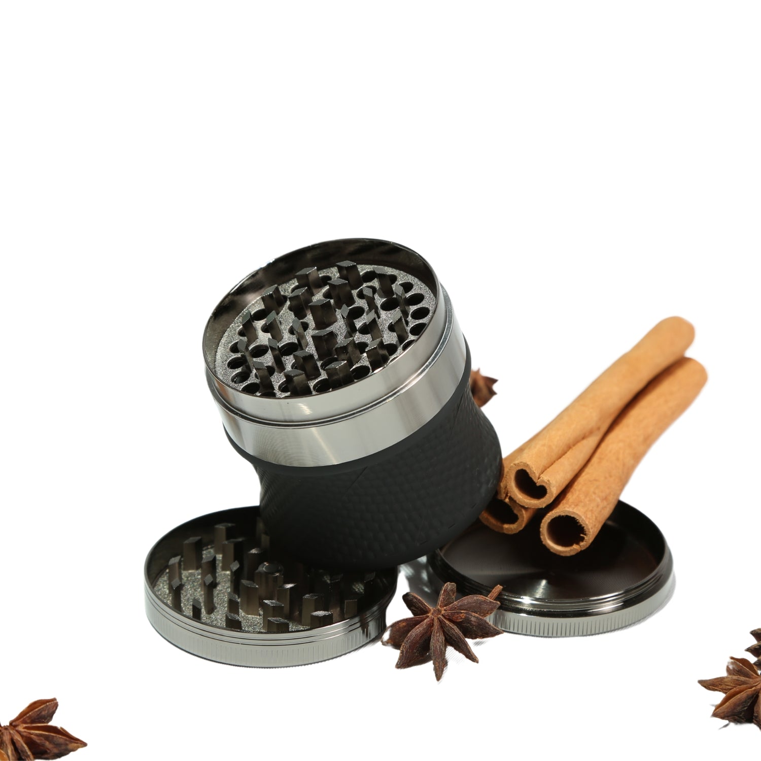 Spice grinder with cinnamon sticks and star anise on a white background 