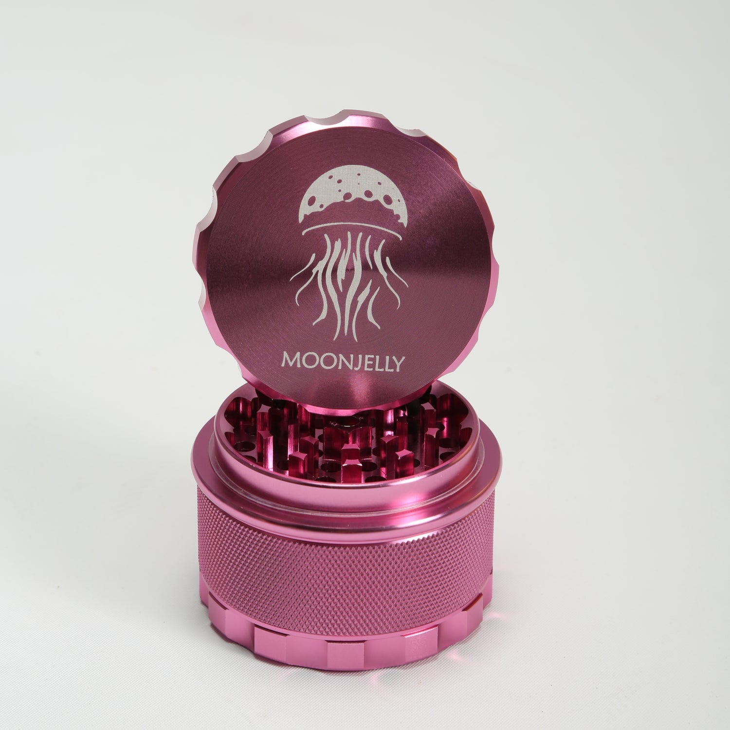 Pink herb grinder with &