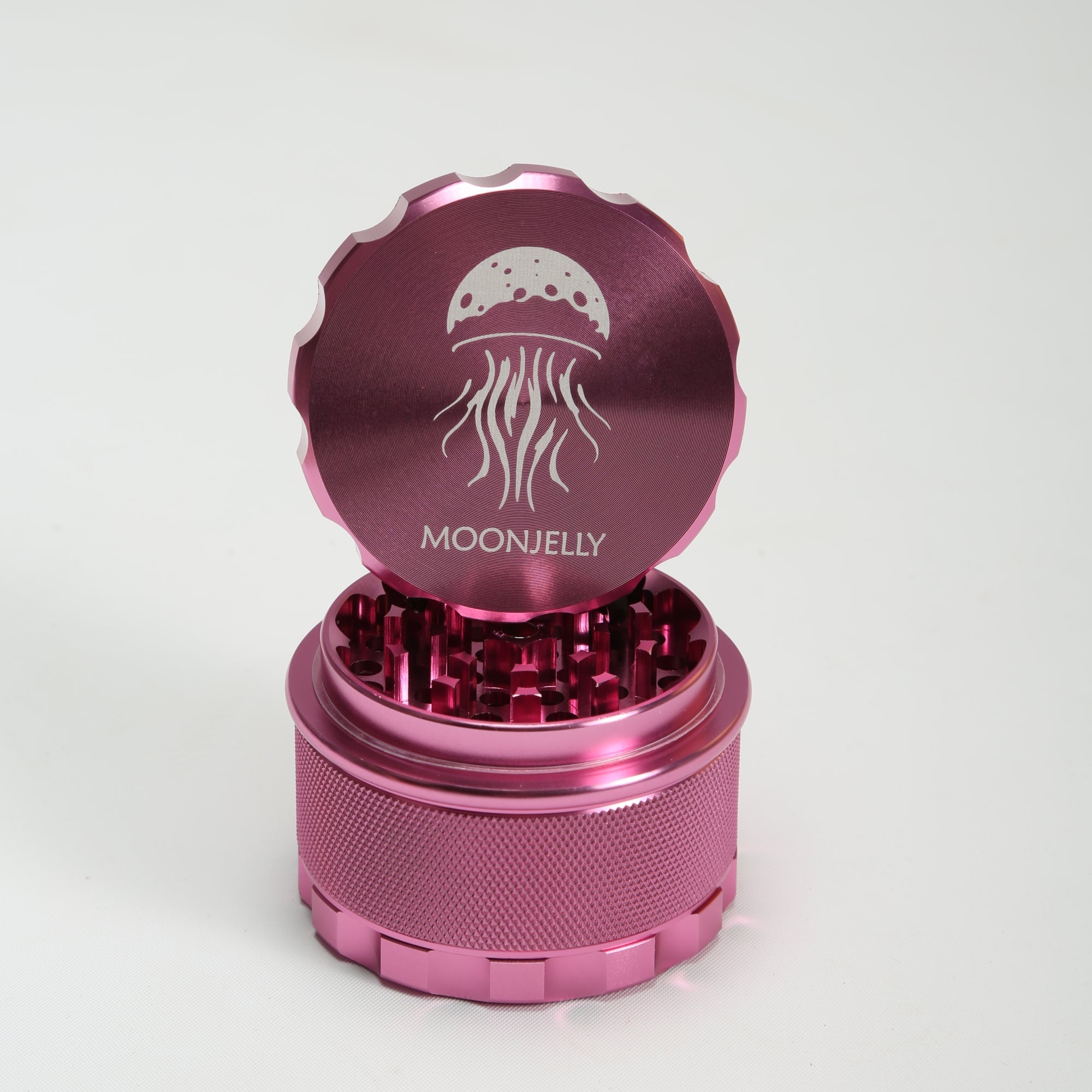 Pink herb grinder with &