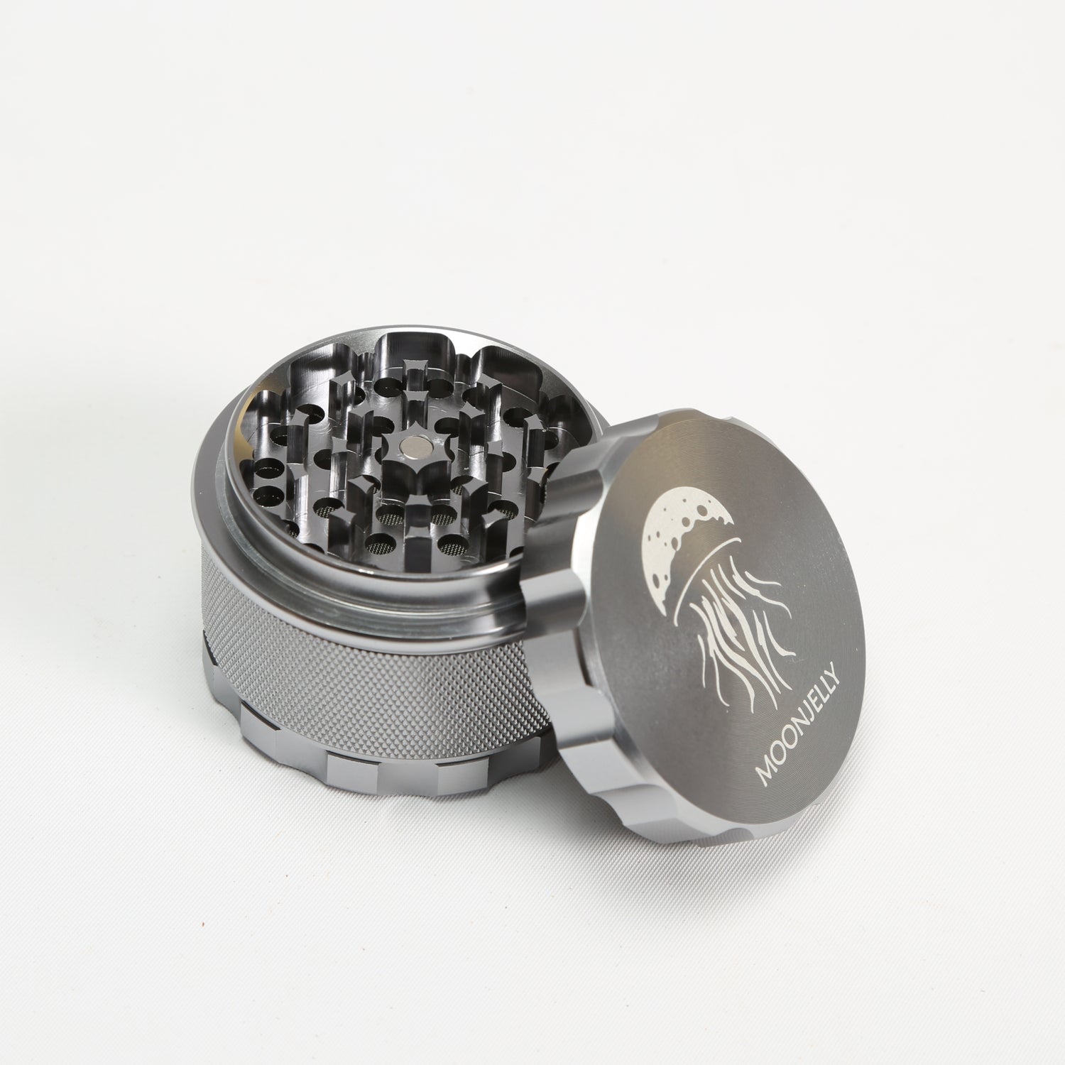 Silver herb grinder with &