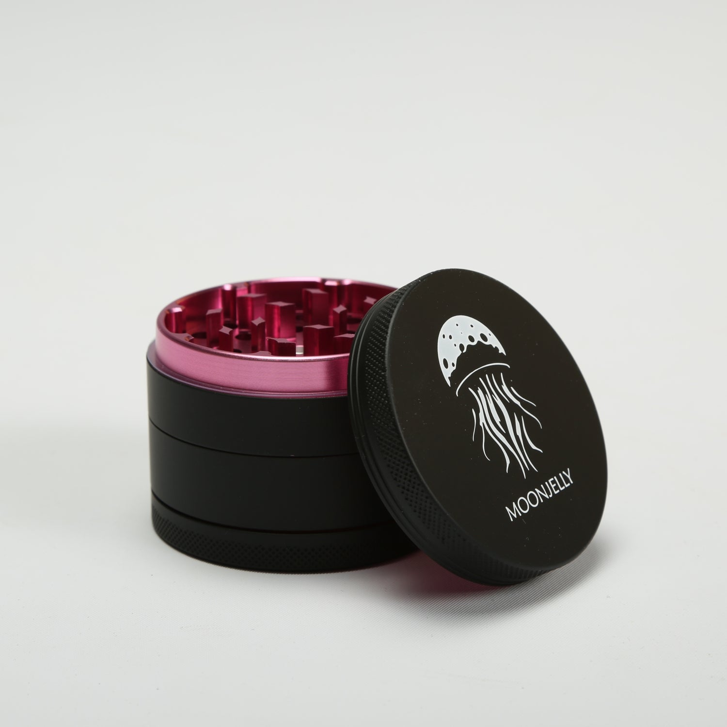 Black and pink herb grinder with &