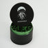 Black and green herb grinder with &