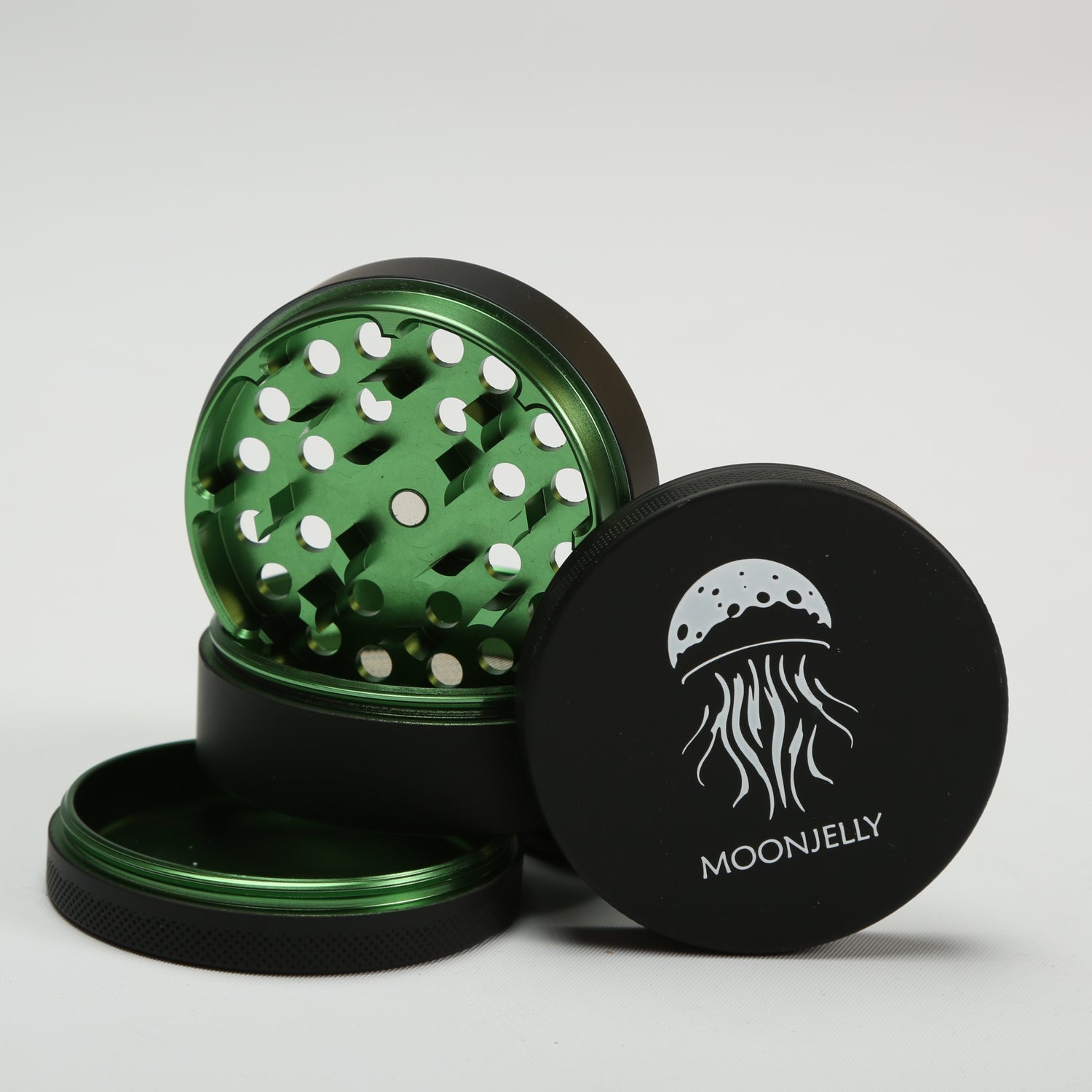 Black and green herb grinder with &