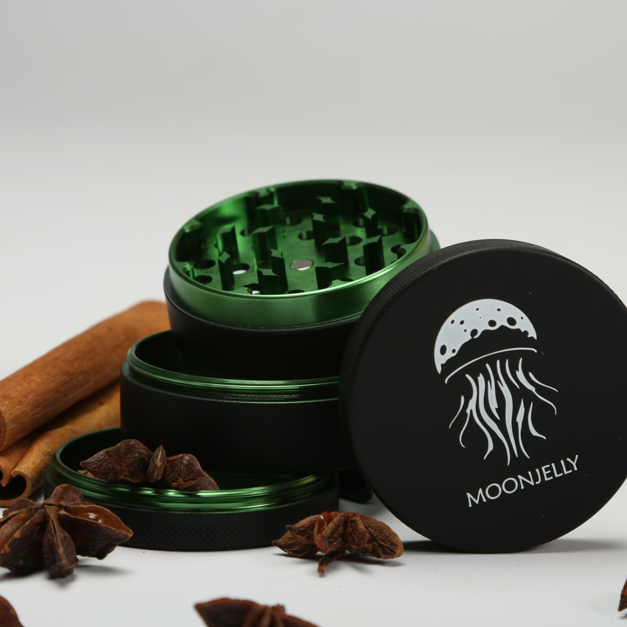 Green and black herb grinder with &